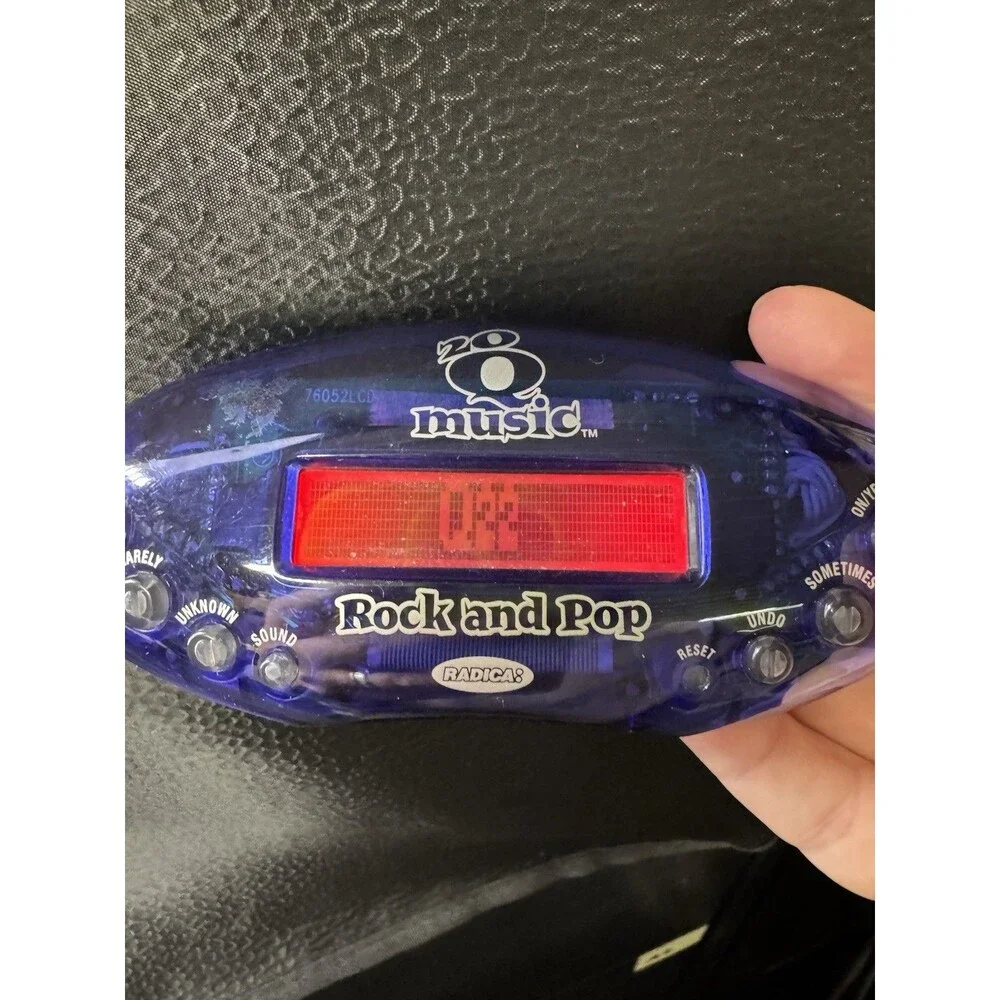 Set of 2 Radica 20Q Handheld Electronic Games Regular and Rock and Pop Music